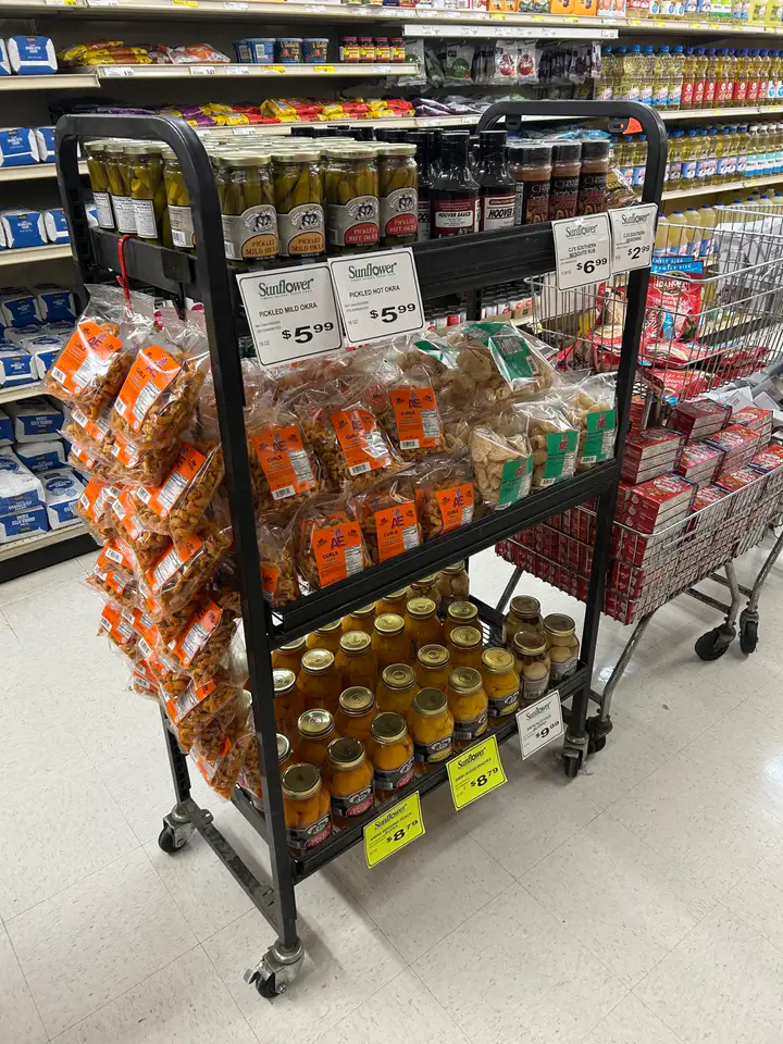 Merchandised rack with pork snacks, pickled foods, and regional products
